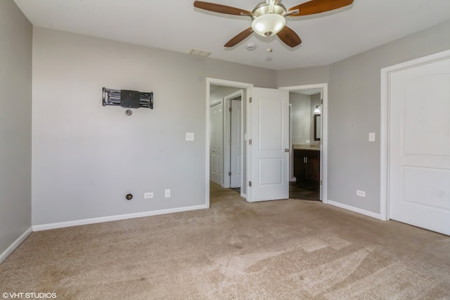 unfurnished bedroom with light colored carpet and ceiling fan