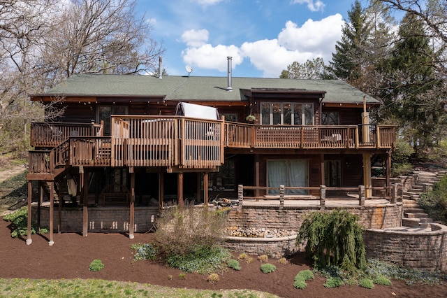 back of house featuring a deck