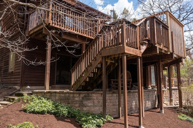 back of property with a wooden deck