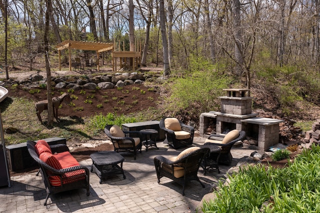 view of patio / terrace with an outdoor living space with a fireplace