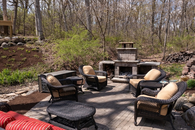 view of patio with an outdoor stone fireplace