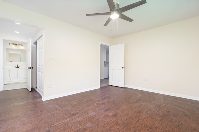 unfurnished bedroom featuring dark hardwood / wood-style flooring, ceiling fan, and ensuite bathroom