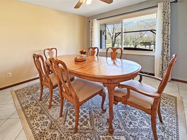 dining space featuring light tile patterned floors and ceiling fan