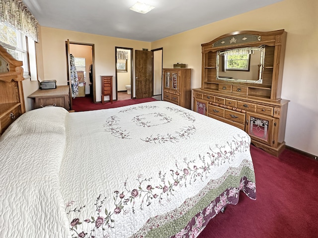 bedroom with dark colored carpet