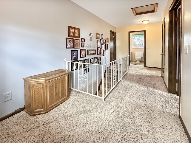 hallway with light colored carpet