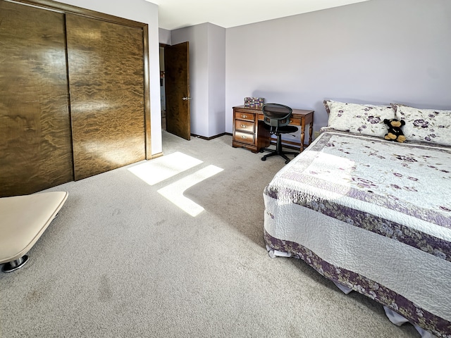 carpeted bedroom featuring a closet