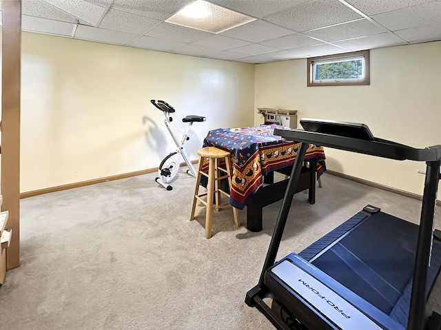 workout room with carpet and a paneled ceiling