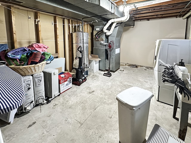 basement featuring gas water heater and heating unit