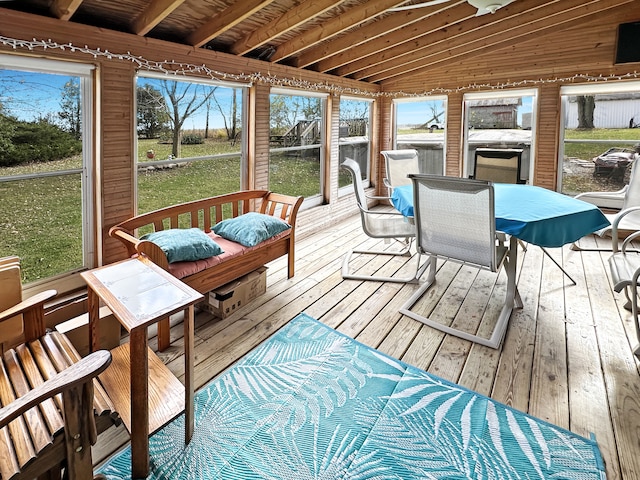 sunroom featuring lofted ceiling and wood ceiling