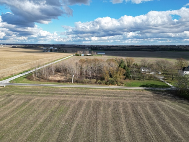 birds eye view of property featuring a rural view