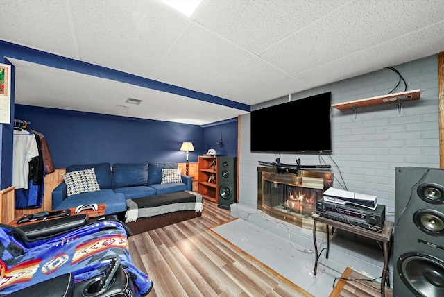 living room featuring a fireplace and hardwood / wood-style flooring