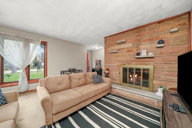 living room featuring carpet, a stone fireplace, and wooden walls