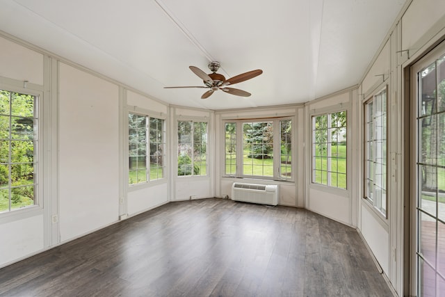 unfurnished sunroom with a healthy amount of sunlight, ceiling fan, and a wall mounted air conditioner