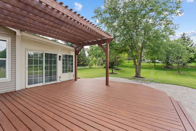 deck with a yard and a pergola