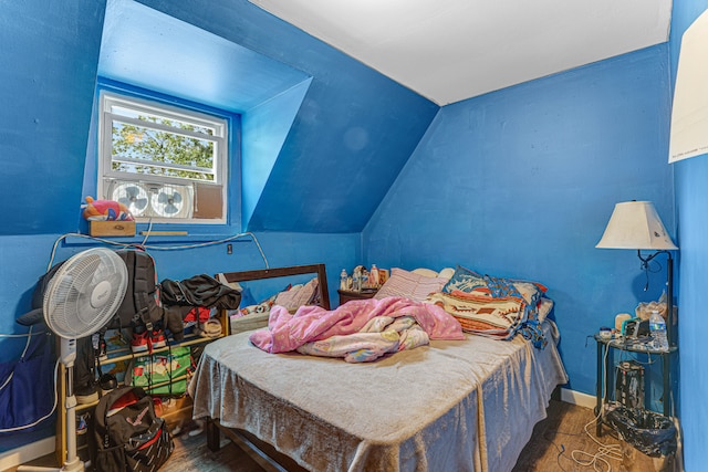 bedroom with lofted ceiling