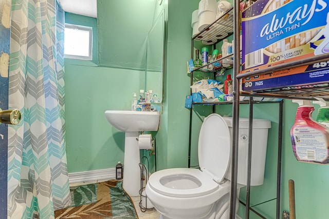 bathroom with a shower and toilet