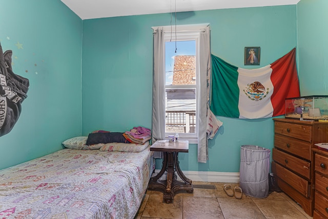 bedroom with tile patterned floors