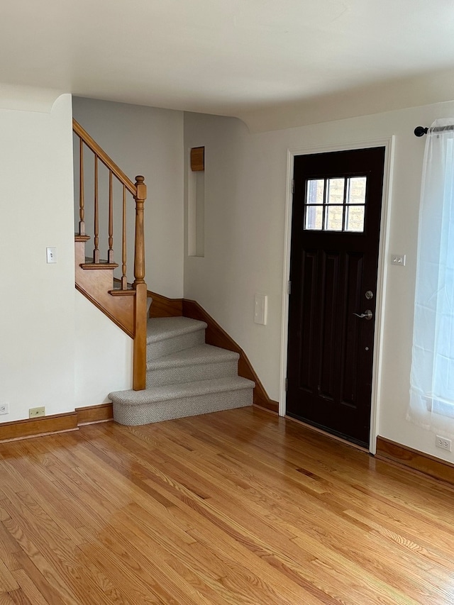 entrance foyer with light hardwood / wood-style floors