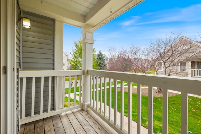 wooden terrace with a yard