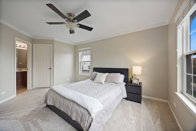 bedroom with ensuite bathroom, multiple windows, crown molding, and ceiling fan