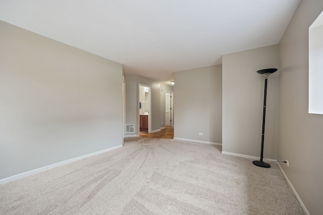 empty room with light colored carpet