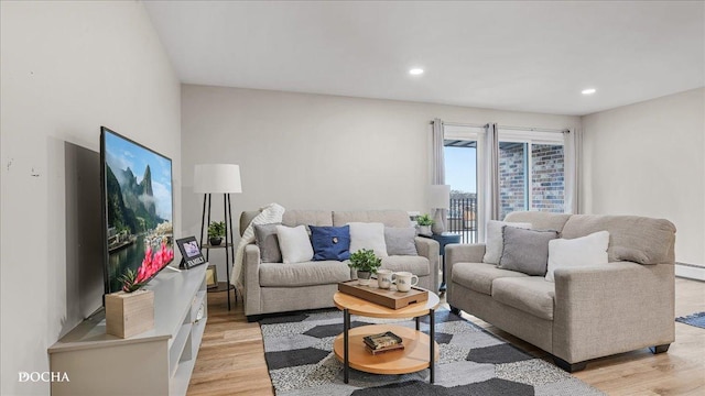 living room with light hardwood / wood-style flooring