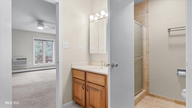 bathroom featuring a shower with door, a wall unit AC, vanity, a baseboard radiator, and toilet