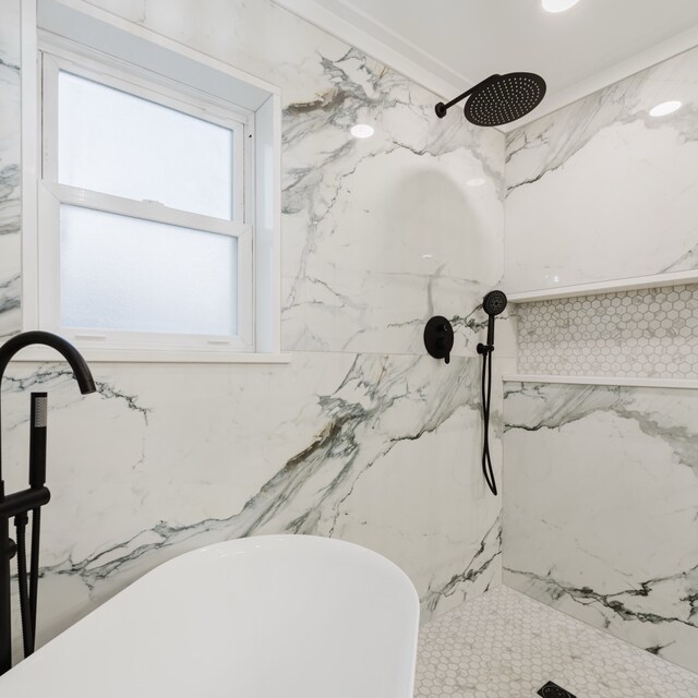 bathroom with a tile shower and sink