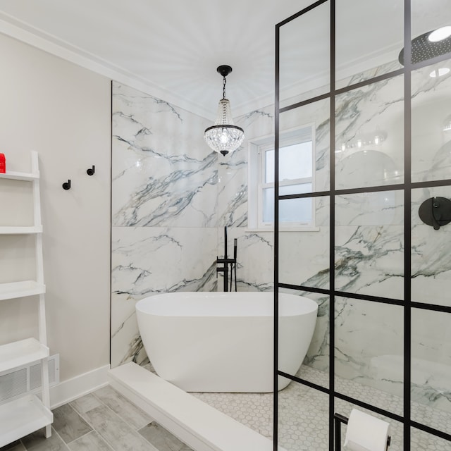 bathroom featuring built in shelves, independent shower and bath, a notable chandelier, and ornamental molding