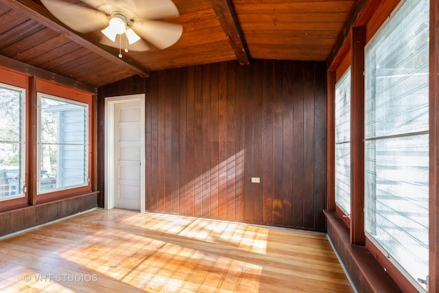 unfurnished sunroom featuring vaulted ceiling with beams, ceiling fan, and wooden ceiling