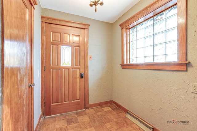 doorway to outside with light parquet flooring