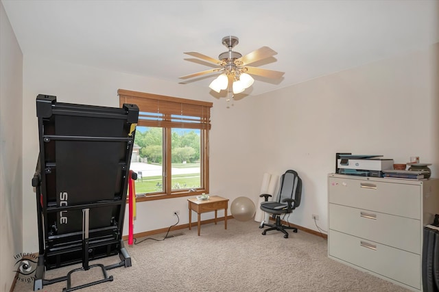 interior space with ceiling fan and carpet