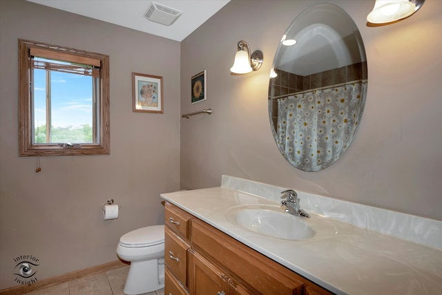 bathroom featuring tile patterned flooring, vanity, toilet, and a shower with shower curtain