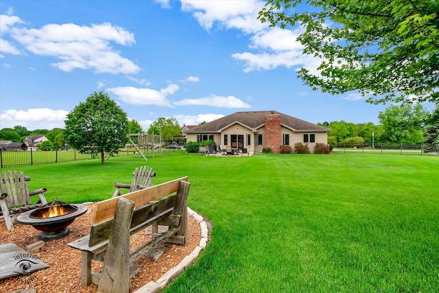 view of yard with a patio area and a fire pit