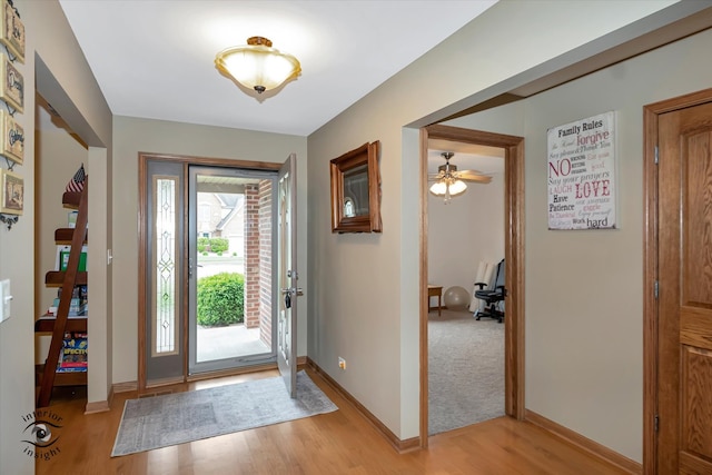 entrance foyer featuring light hardwood / wood-style flooring and ceiling fan