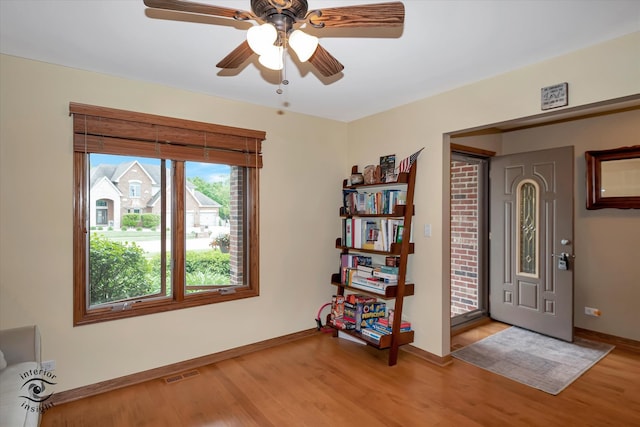 entryway with light hardwood / wood-style floors and ceiling fan