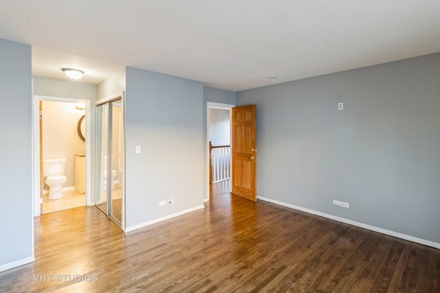 spare room with wood-type flooring