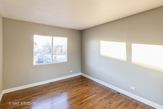 empty room featuring dark hardwood / wood-style floors