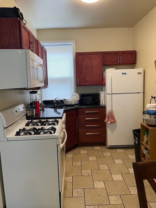 kitchen with white appliances and sink