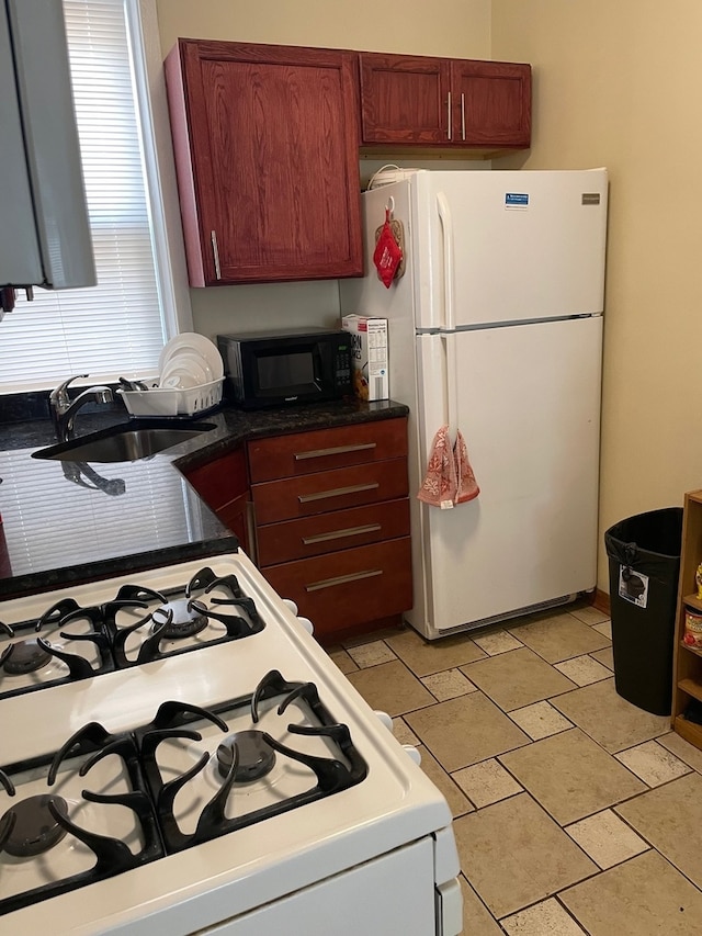 kitchen with white appliances and sink