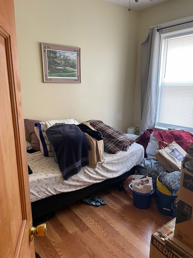 bedroom with wood-type flooring