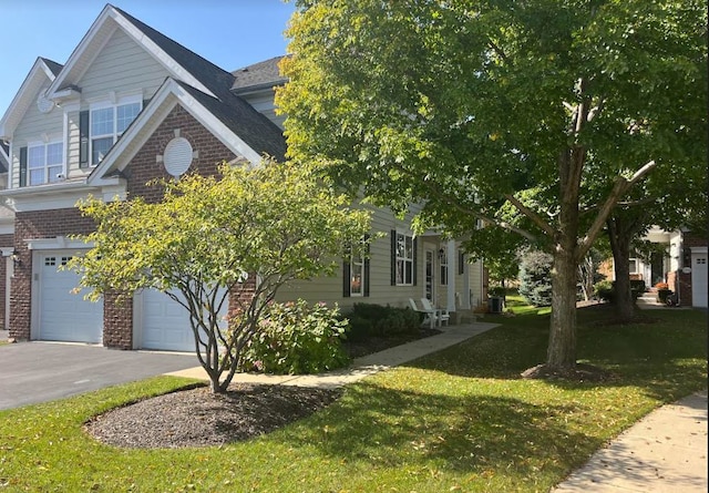 view of front of property with a garage and a front lawn