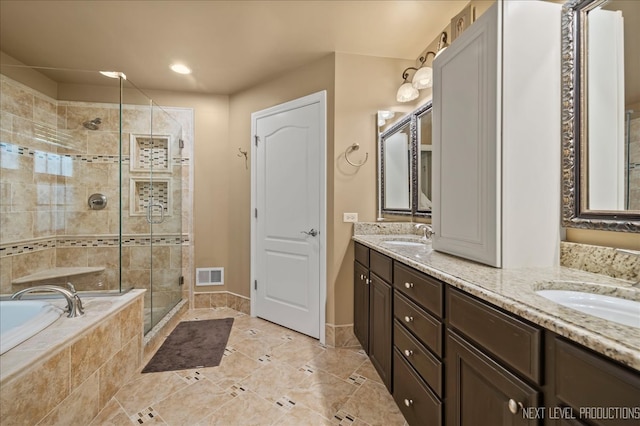 bathroom featuring vanity and plus walk in shower