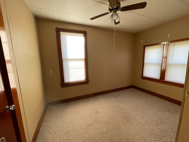 unfurnished room featuring light colored carpet and ceiling fan