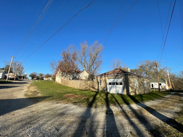 view of side of property with an outbuilding and a garage