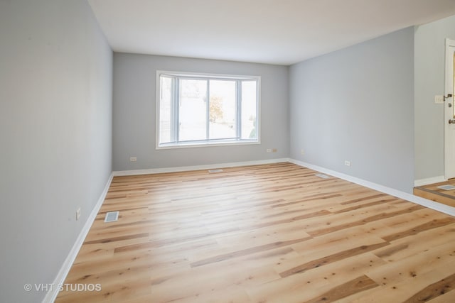 empty room with light wood-type flooring