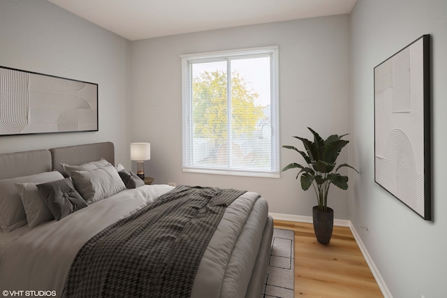 bedroom with light hardwood / wood-style floors