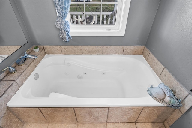 bathroom featuring a relaxing tiled tub