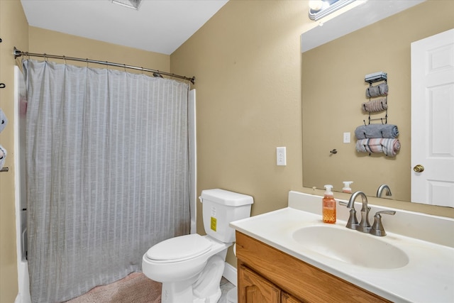 full bathroom featuring vanity, shower / bath combination with curtain, and toilet