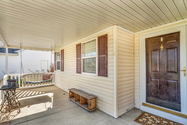 doorway to property with a porch